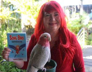 Karen Tyrrell holding Song Bird med res