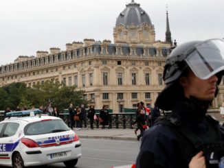 French police secure the area in front of the Paris Police headquarters in Paris